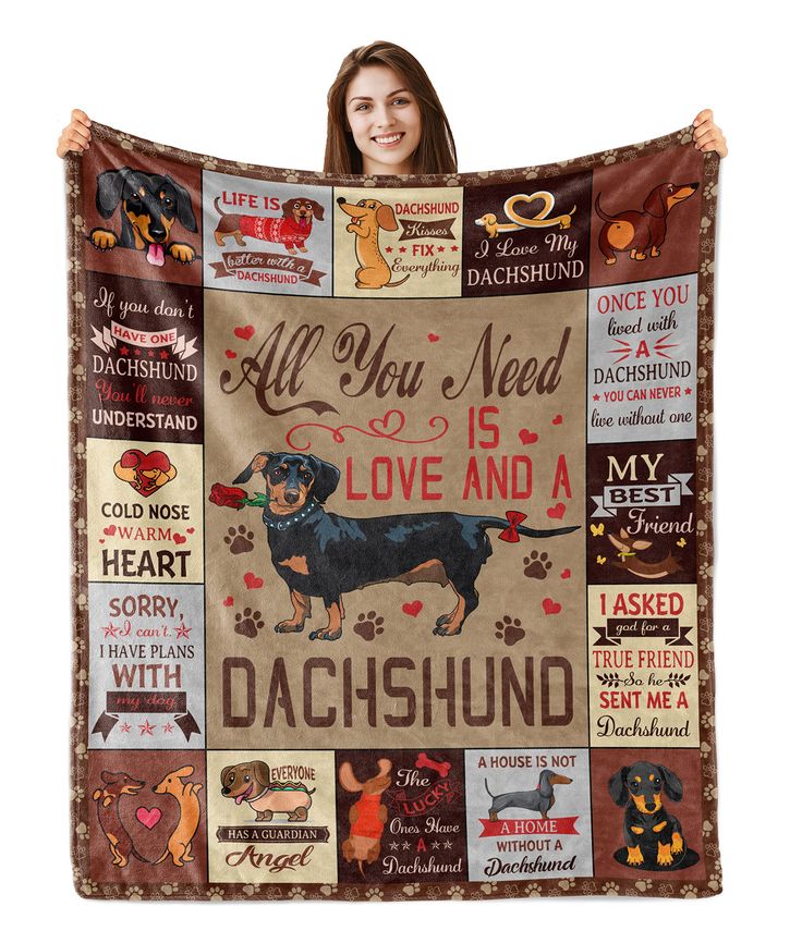 a woman is holding up a blanket with her dog's names and pictures on it