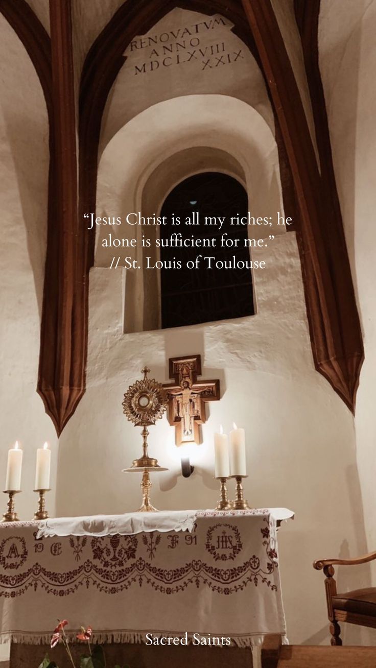 the altar is adorned with candles and an old quote from pope john i - jesus