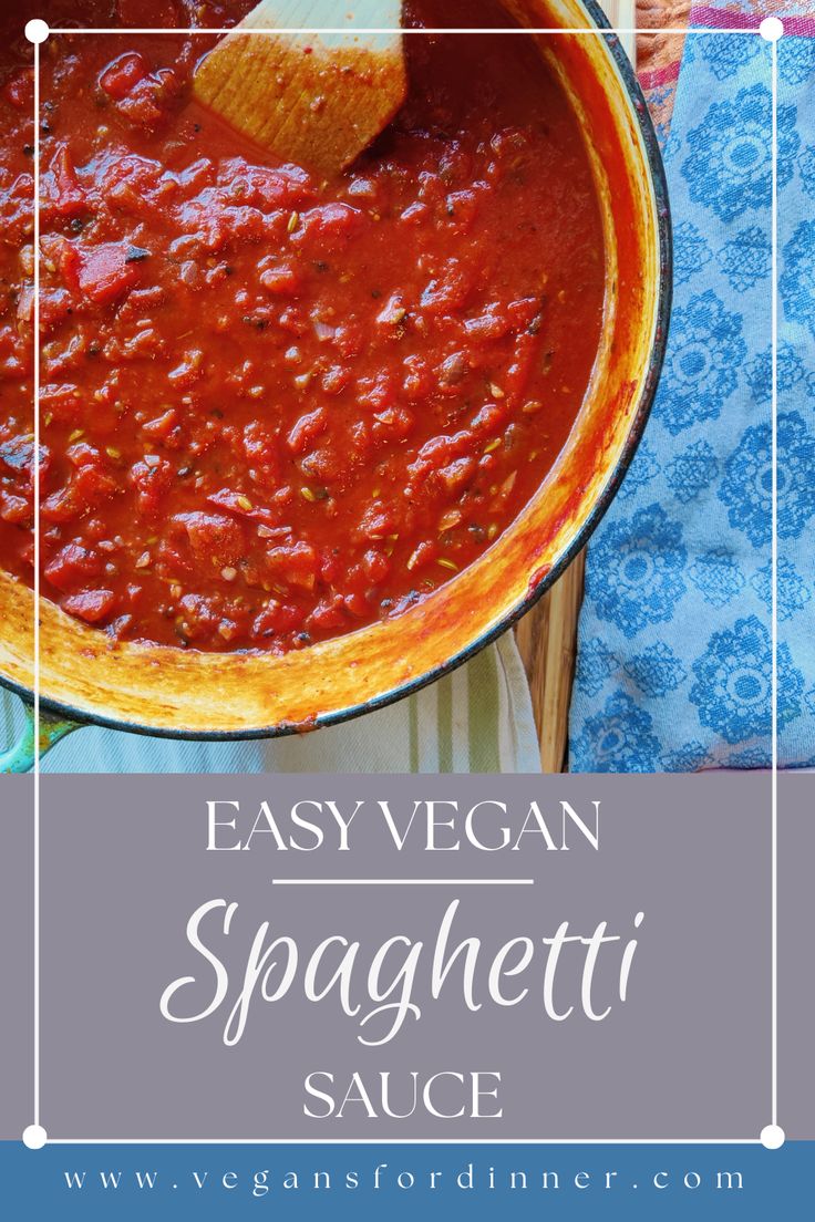 easy vegan spaghetti sauce in a skillet with a wooden spoon on the side