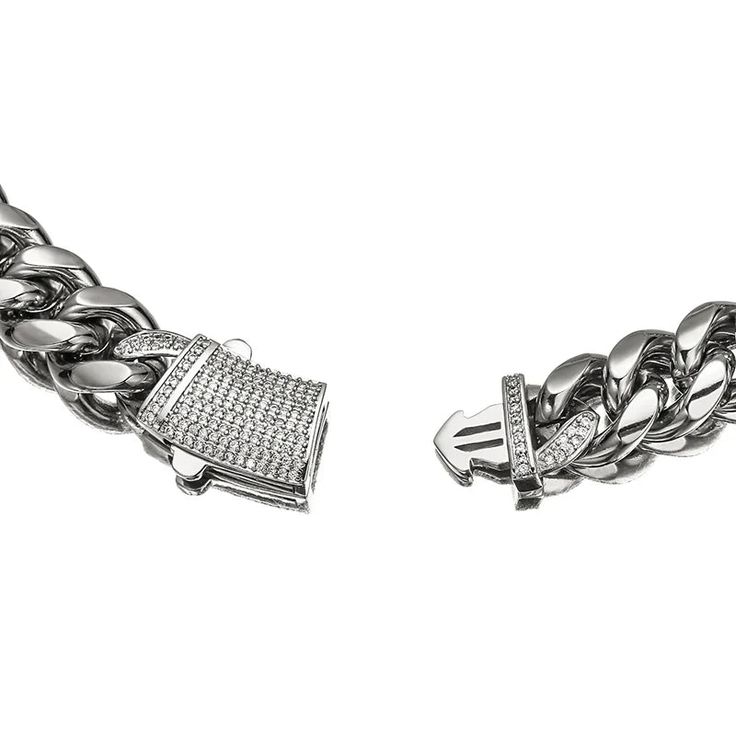 The Pave Clasp Miami Cuban Link Chain. Featuring a large and distinctive rectangular box clasp, encrusted with clear stones that create a dazzling shine. This substantial piece makes a statement, adding a touch of opulence to any outfit. PVD Plating guarantees a long-lasting finish Elegant Rectangular Iced Out Jewelry, Rectangular Cubic Zirconia Jewelry With Rhinestones, Silver Cuban Link Jewelry With Rhinestones, Rectangular Silver Bracelet With Diamond Accents, Luxury Silver Square Jewelry, White Gold Link Jewelry With Box Clasp, Elegant Cuban Link Rhinestone Jewelry, Rectangular Cubic Zirconia Jewelry With Diamond Accents, Luxury Crystal Jewelry Rectangular Shape