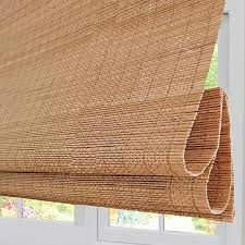 a close up of a bamboo blind with the blinds pulled back to look like woven fabric