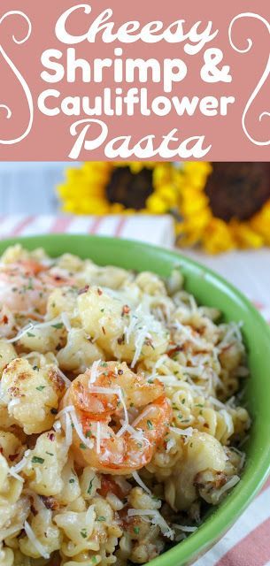 shrimp and cauliflower pasta in a green bowl with sunflowers behind it