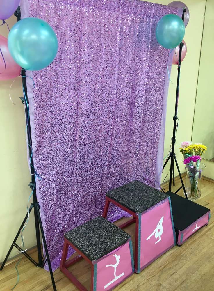 a stage set up for a gymnastics themed birthday party