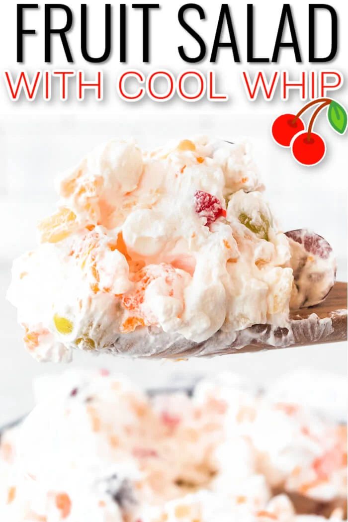 a spoon full of fruit salad with cool whip on it and the title overlay