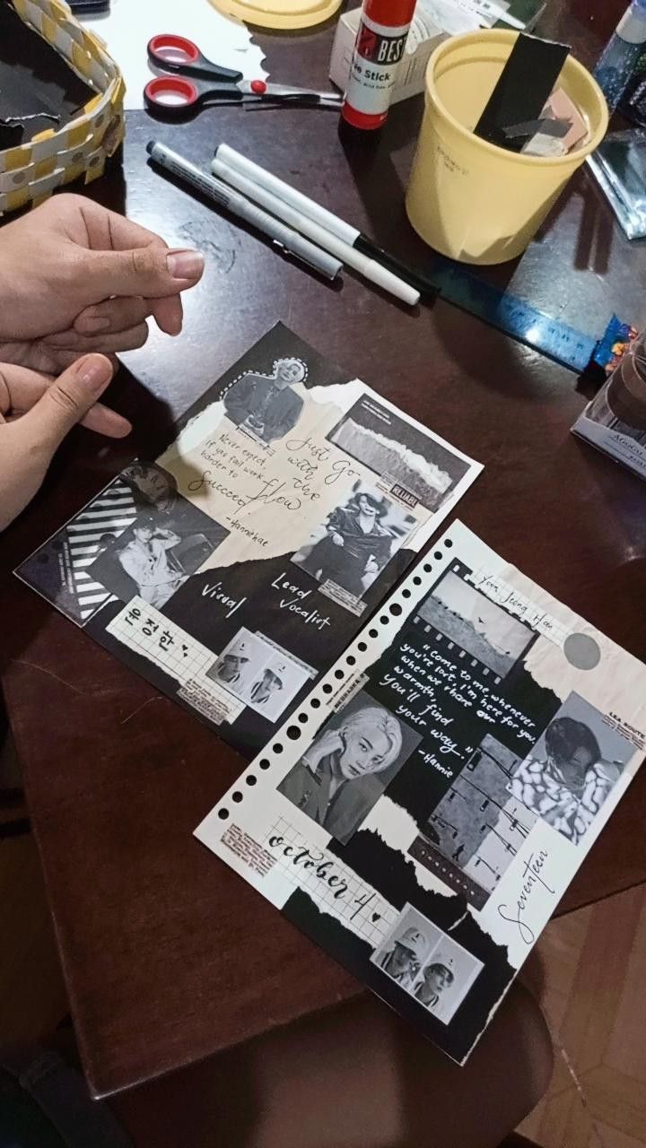 a person is making a scrapbook on a table