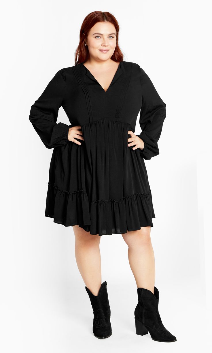 Love a fabulous wardrobe refresh with the Alinda Mini Dress. The ruffle hem adds a charming touch to your look along with flowy lightweight fabrication. Complete with a notched V-neckline, this dress is made-to-be-seen with its gorgeous style. Key Features Include: - Notched V-Neckline - Full length sleeve with elastic cuff - Waist definition - Ruffle hemline - Lightweight fabrication - Mini length Team with slingback heels and gold accessories. | Plus Size Alinda Mini Dress in Black, Size 20 | Flowy Tiered V-neck Dress With Ruffle Hem, Chic Tiered V-neck Dress With Ruffle Hem, Chic V-neck Tiered Dress With Ruffle Hem, Flowy V-neck Dress With Ruffle Hem For Brunch, Flowy V-neck Ruffle Dress With Ruffle Hem, V-neck Midi Dress With Ruffle Hem In Rayon, V-neck Rayon Midi Dress With Ruffle Hem, Rayon V-neck Midi Dress With Ruffle Hem, Chic Rayon Midi Dress With Ruffle Hem