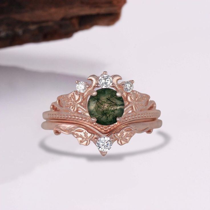 A stunning and spectacular natural moss agate design, this stunning ring set is the ideal option to complement any wardrobe or outfit you may have been considering. Each ring set is made from your choice of our premium rose gold vermeil. Embedded with a natural moss agate it's a design that's ideal for any occasion.  ✦ DETAILS ✦ ✧ Handcrafted  ✧ 6mm  center stone ✧ Natural moss agate ✧ Sizes 3.75-14.25 ✧ 14K Rose Gold Vermeil  ✧ This ring set will arrive ready to gift in a Kherish Jewelry Pouch. ✧ PRE-ORDER: Items that are preorder only will ship within 10-15 business days. You will receive an email with the updated processing time if you order a size/option that qualifies for pre-order. ✧ 14K Solid Gold Options ✧     This option will ship within 10-15 business days.  You will receive an e Feather Engagement Ring, Moss Agate Jewelry, Rose Gold Ring Set, Timeless Ring, Green Moss Agate, Moss Agate Ring, Engagement Ring For Women, Gold Feathers, Alternative Engagement Rings