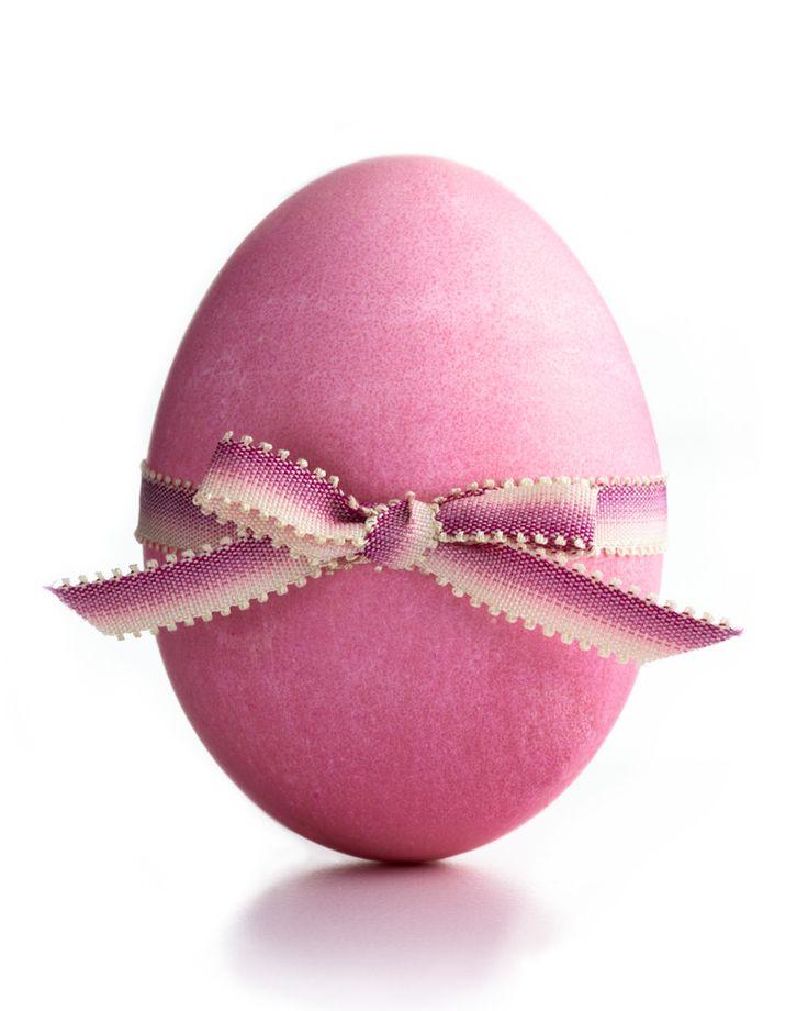 an easter egg with a ribbon on it