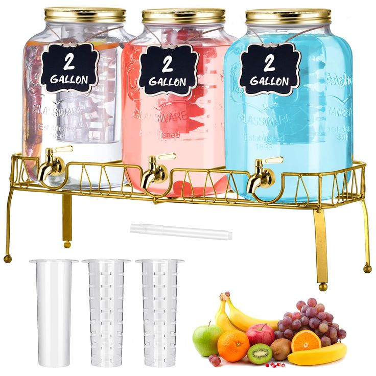 three mason jars with labels on them are next to fruit and two cups that have straws in them