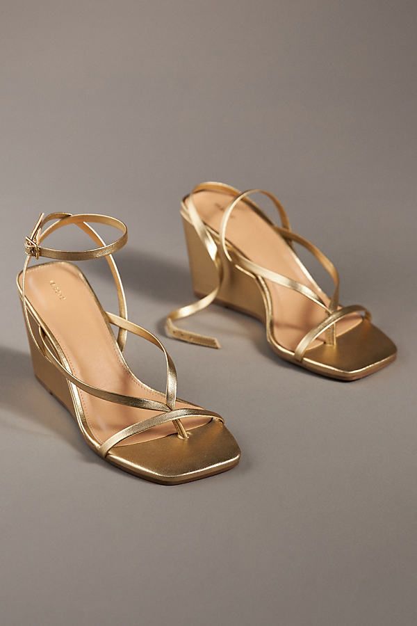 Leather upper, insole Rubber sole Buckle styling Imported | Strappy Wedge Heels by Maeve in Gold, Women's, Size: 39, Leather/Rubber at Anthropologie Vintage Wedge Heels, Gold Wedge Sandals, Cute Wedge Heels, Modern Gold Wedge Sandals For Party, Modern Gold Wedge Sandals For Spring, Modern Gold Wedge Sandals For Summer, Gold Synthetic Wedge Sandals With Heel Loop, Modern Gold Wedge Sandals With Round Toe, Gold Wedge Sandals With 4-inch Heel