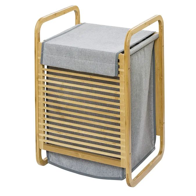 a bamboo and fabric laundry hamper on wheels with grey linen linings, in front of a white background