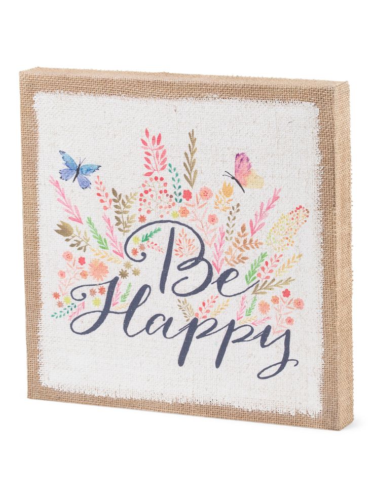 a burlap box with the words be happy written on it and colorful flowers