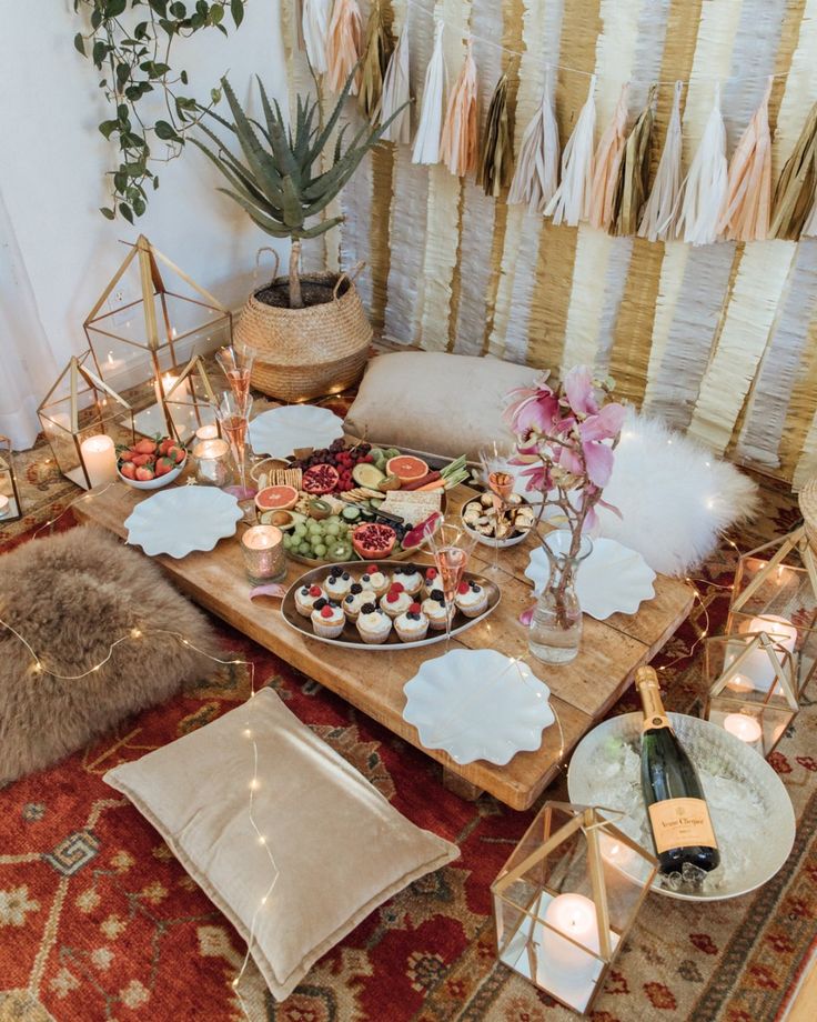 an instagram photo with food and candles on the table in front of a couch