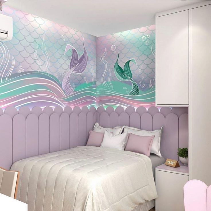 a bedroom with mermaid themed wallpaper and white furniture