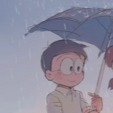 two people standing under an umbrella in the rain