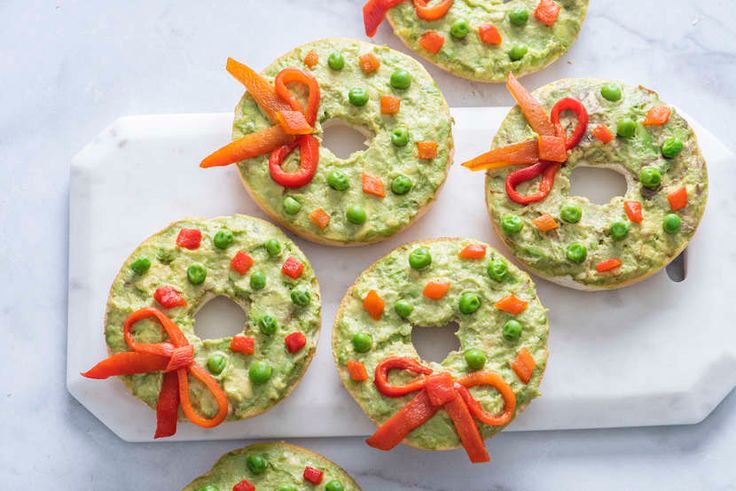 christmas cookies decorated with peas and carrots