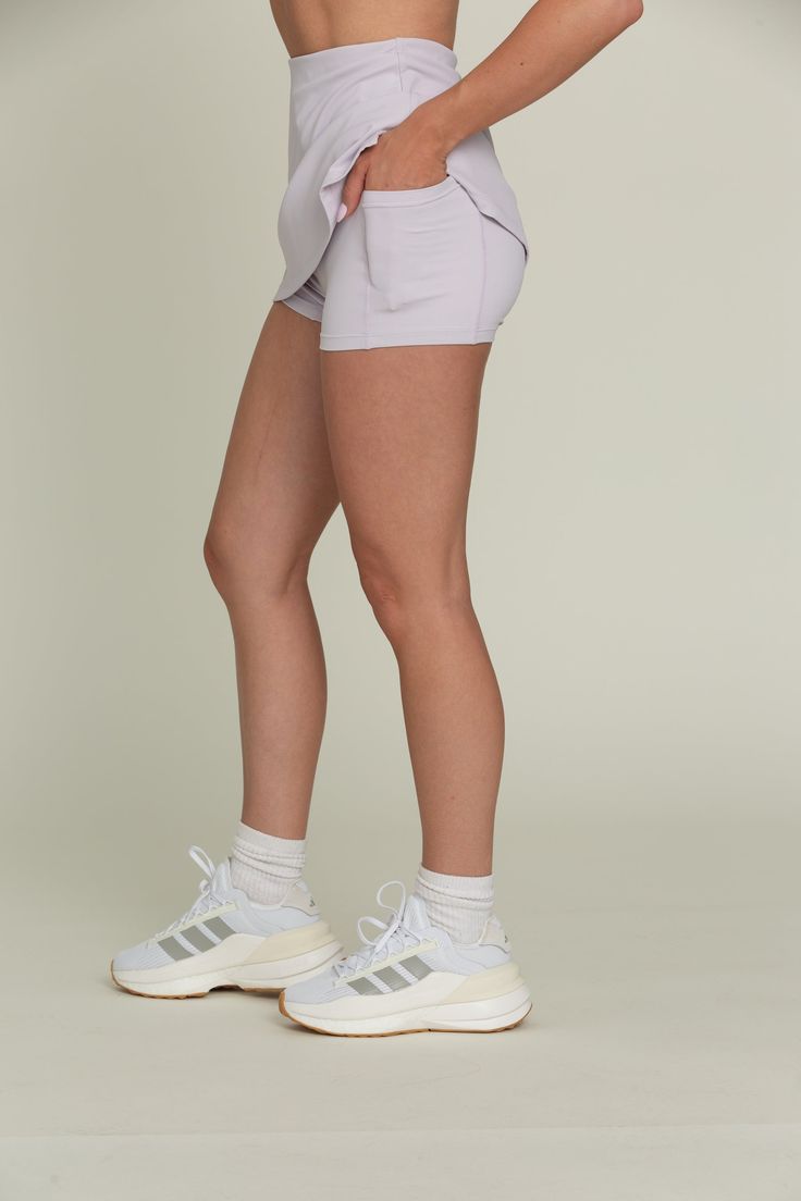 Our Pale Lavender Simple Skort is designed for both style and functionality. With built-in spandex shorts for added coverage and hidden dual side pockets for convenience, this skort is designed for both style and functionality. Made from quick-dry material, it ensures you stay comfortable and dry during activities. Perfect for golf, tennis, and more, this versatile skort is a must-have for any active lifestyle. Athleisure Skort With Pockets For Gym, Athleisure Gym Skort With Pockets, Workout Tennis Skirt With Built-in Shorts, Athleisure Workout Skort With Built-in Shorts, Workout Nylon Tennis Skirt With Built-in Shorts, Athleisure Workout Skort With Pockets, Sportswear Stretch Skort With Built-in Shorts, Sporty Workout Skort With Built-in Shorts, Casual Training Skort With Built-in Shorts