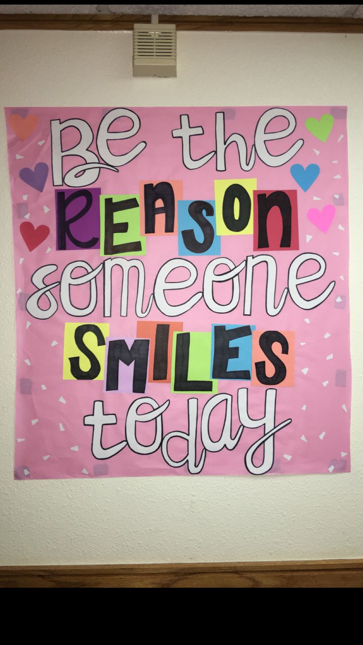 a pink poster with the words be the reason someone smiles today written in multicolored letters