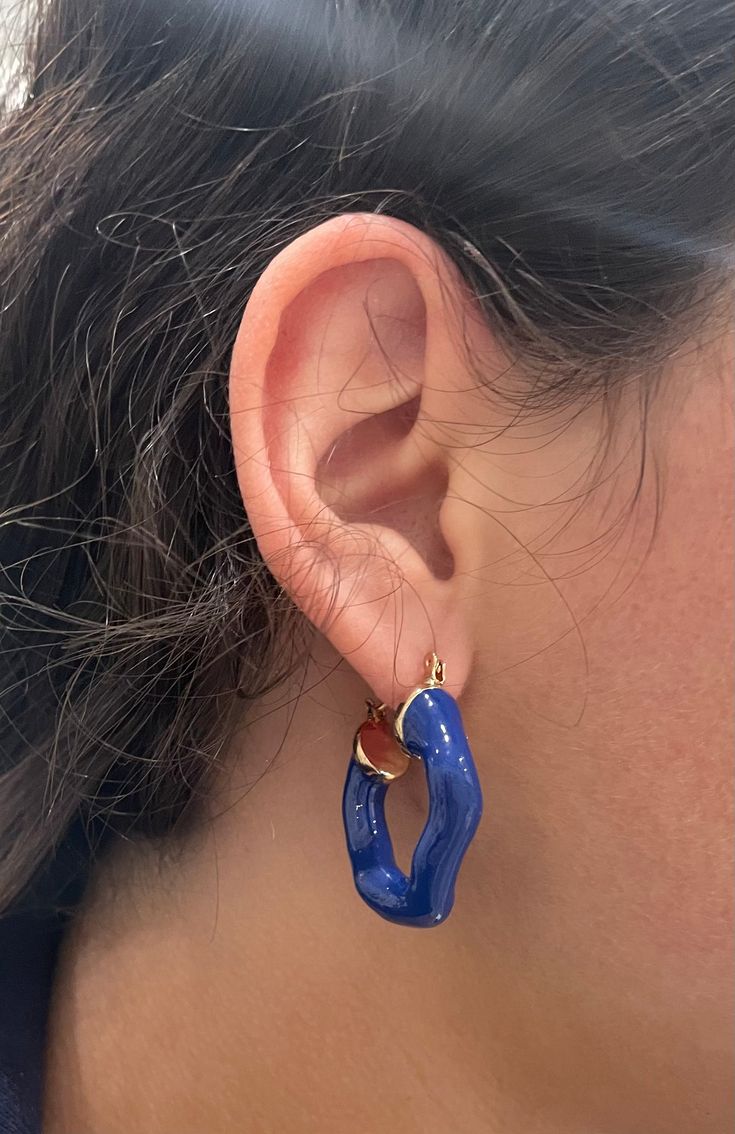 Amplify your earring collection with the Jarol Abstract Hoop. This unique stunner features a perfectly imperfect hoop in a beautiful royal blue. 1 1/2 " 18k plated with an enamel coating Made to last Water & tarnish resistant Trendy Blue Enamel Jewelry, Blue Hypoallergenic Hoop Jewelry, Blue Hypoallergenic Small Hoop Jewelry, Hypoallergenic Blue Small Hoop Jewelry, Hypoallergenic Blue Hoop Jewelry, Blue Metal Hoop Earrings, Blue Small Hoop Jewelry, Blue Small Hoop Earrings, Blue Tarnish Resistant Hoop Earrings