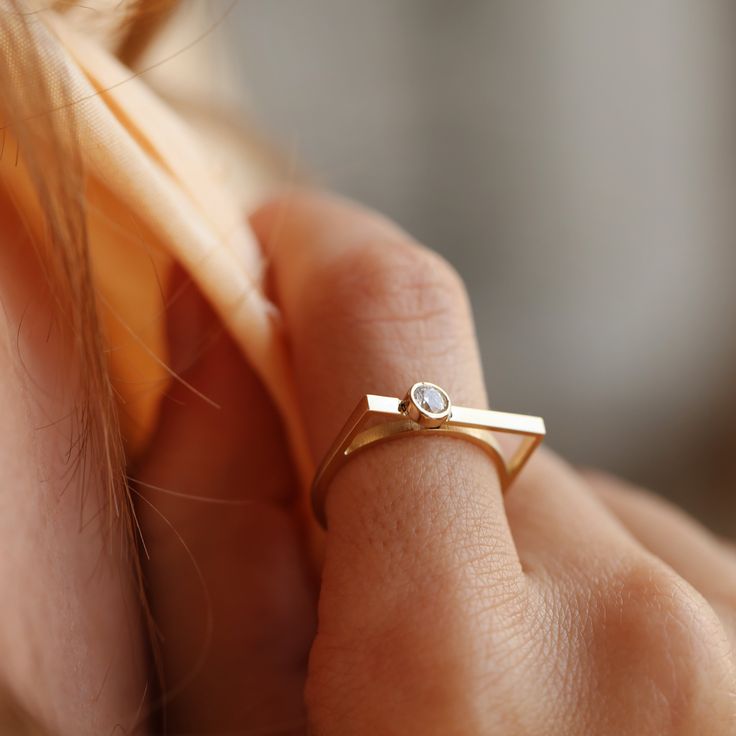 Elevate your style with our stunning collection of handcrafted gold rings on Etsy. From classic round-cut designs to modern geometric shapes, each piece is meticulously crafted to perfection. Our zircon embellished rings add a touch of sparkle, while our minimalist and stackable options offer versatility for everyday wear. Whether you're celebrating an anniversary, birthday, or searching for the perfect Mother's Day gift, our delicate and handmade rings are sure to delight. Available in rose gold, yellow gold, or 14k white gold, each ring is a timeless treasure to cherish. Shop now and discover the beauty of handcrafted jewelry. Modern Solitaire Jewelry For Everyday, Minimalist Open Ring With Single Cut Diamonds, Modern Stackable Diamond Midi Rings, Modern Everyday Rings With Bezel Setting, Modern Everyday Solitaire Stackable Rings, Modern Everyday Stackable Solitaire Rings, Modern Diamond Birthstone Ring With Round Cut, Modern Round Cut Birthstone Ring With Single Diamond, Modern Diamond Ring With Bezel Setting For Everyday