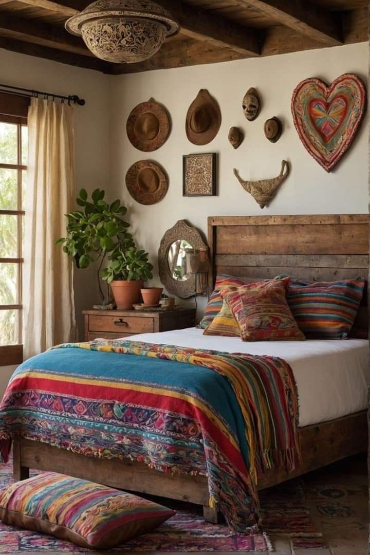 a bed room with a neatly made bed and lots of decorations on the wall above it