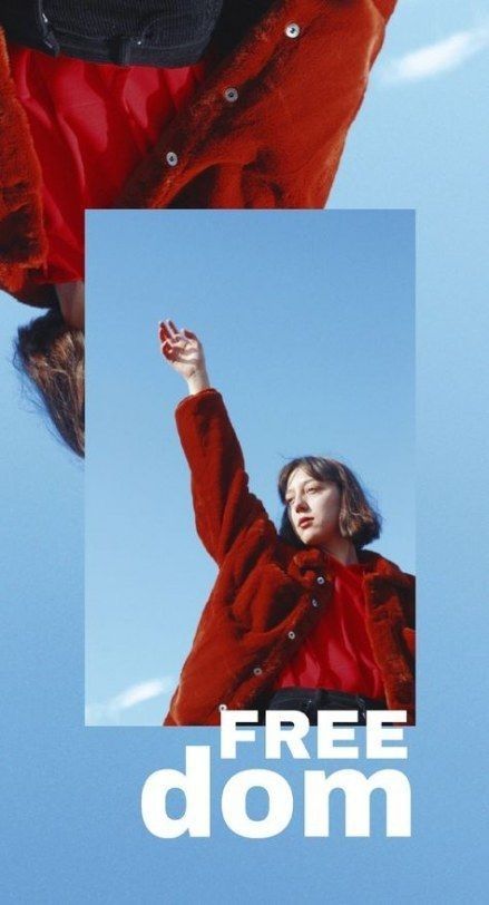 a woman is flying through the air with her hand up in the air, while wearing a red coat