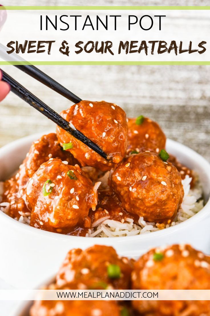 someone is holding chopsticks over some meatballs on top of rice in a bowl