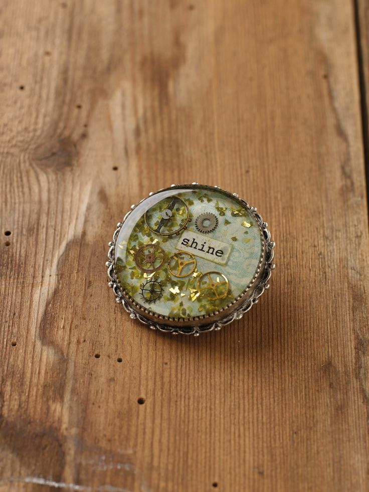 a ring that is sitting on top of a wooden table next to a bottle opener