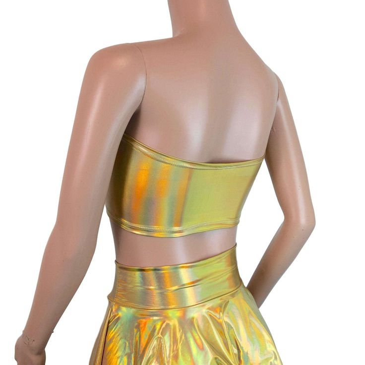 Stretch gold opal holographic tube top. This tube top is sewn to fit your curves and not flatten you out, while fitting snug enough to stay up :) Metallic Strapless Tube Top For Party, Strapless Gold Tube Top For Summer, Metallic Strapless Tube Top For Night Out, Stretch Strapless Crop Top For Club, Strapless Stretch Crop Top For Club, Fitted Gold Strapless Tube Top, Gold Strapless Top For Party, Stretch Crop Top Tube Top For Party, Metallic Fitted Tube Top For Night Out