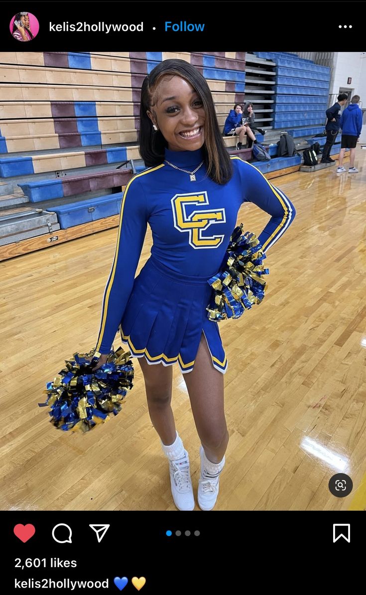 a cheerleader is smiling and posing for the camera