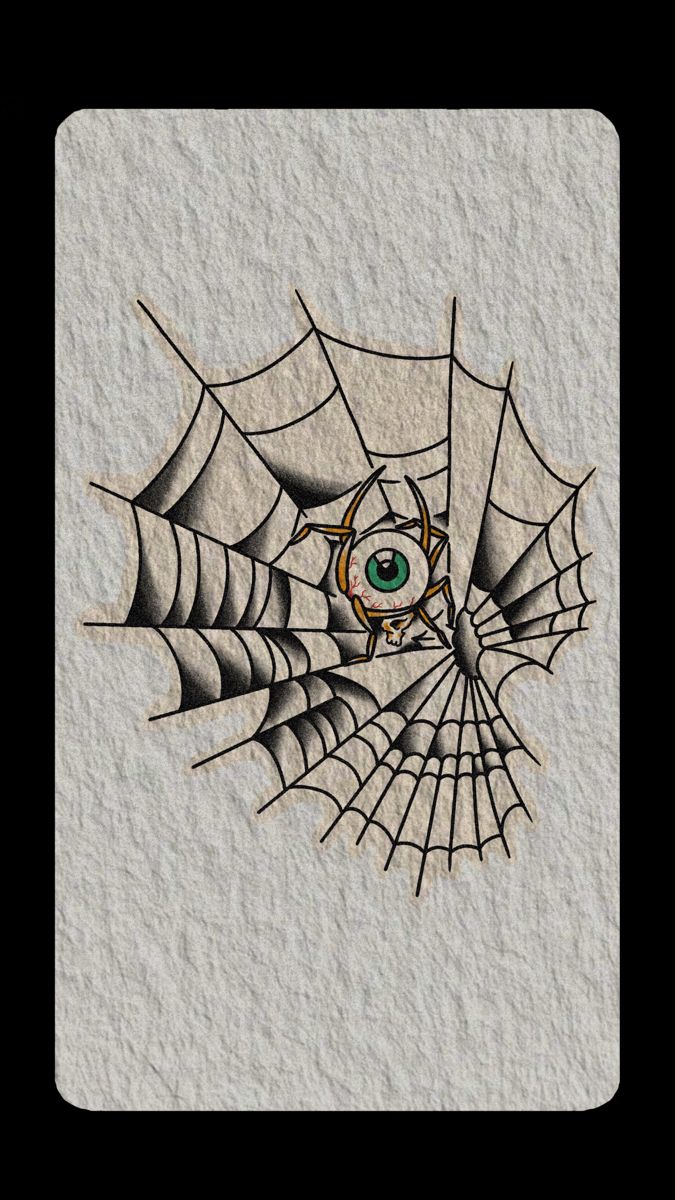 a spider web with an eye in the center