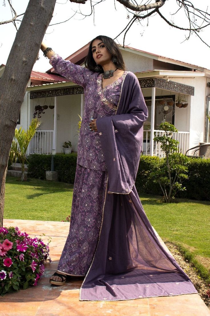 This mul mul set is a angrakha kurta with shrara pants and mul mul dupatta embroidered with gota work making it perfect for summers. Eid Straight Kurta Set With Gota Work, Purple Palazzo Set With Dabka Work And Straight Kurta, Purple Georgette Palazzo Set With Straight Kurta, Eid Gota Work Straight Kurta Set, Unstitched Straight Kurta Palazzo Set With Gota Work, Semi-stitched Mulmul Palazzo Set For Diwali, Bollywood Style Purple Palazzo Set With Dupatta, Purple Chanderi Kurta With Mirror Work, Bollywood Style Purple Palazzo Set With Mirror Work