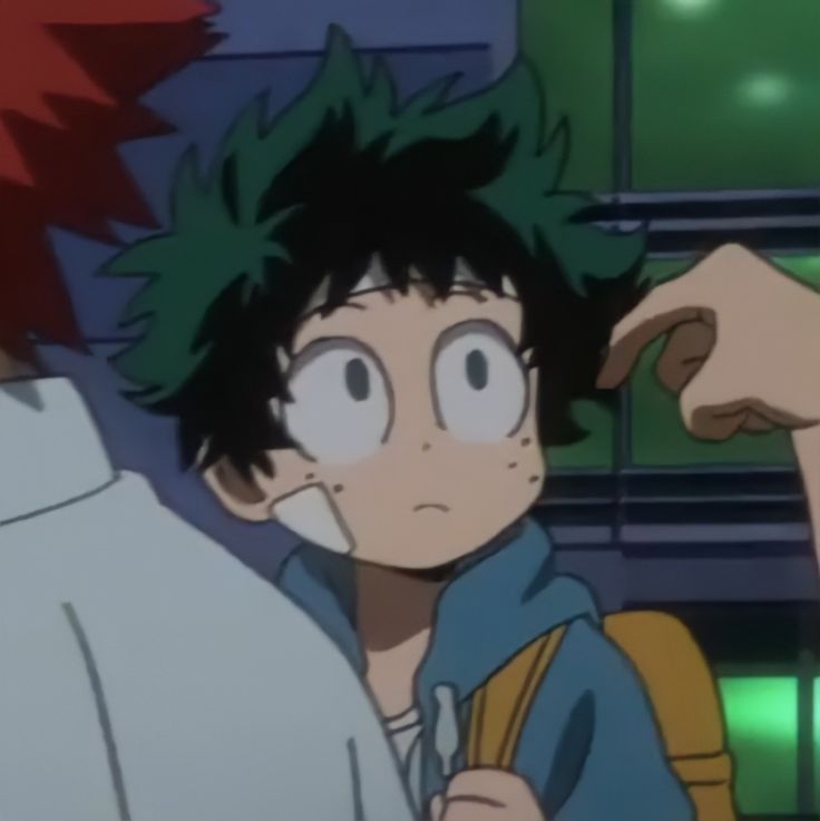 an anime character with black hair and green eyes looking at another person's shoulder