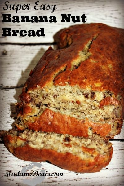 a loaf of banana nut bread sitting on top of a wooden table