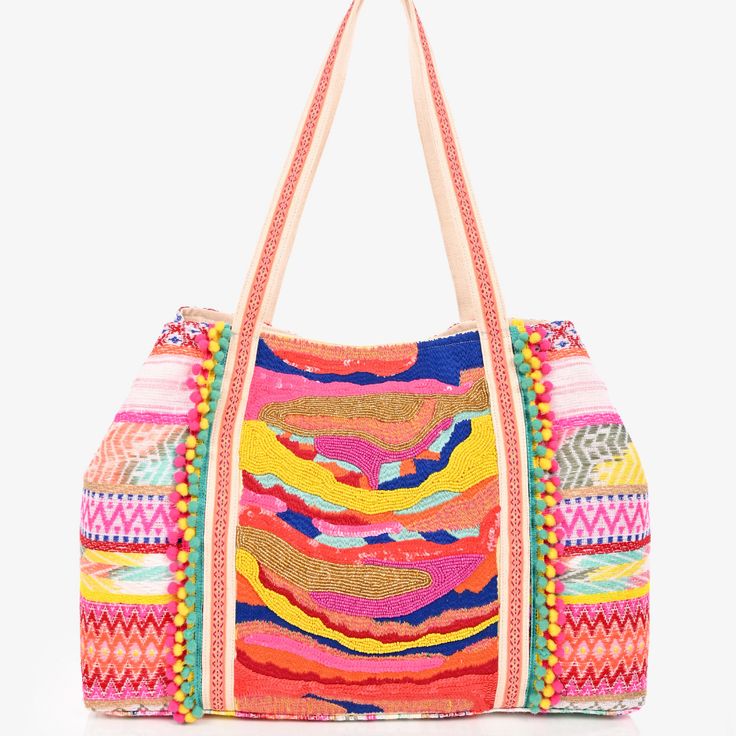 The Isabella Adorned Tote is a beautifully crafted, woven bag in a kaleidoscope of colors - including yellow, pink, blue, and gold. It showcases intricate, hand-embellished needlework and beading, with playful mini pompom accents for the perfect finishing touch. Magnetic Button Closure Lined Interiors with Zip Pocket and Mobile Pocket Size 24" X 13" X 6" Spring Bohemian Beaded Bags, Bohemian Beaded Bags For Vacation, Bohemian Beaded Shoulder Bag For Summer, Summer Bohemian Beaded Shoulder Bag, Bohemian Beaded Shoulder Bag For Vacation, Pink Beaded Tote Bag, Multicolor Embroidered Travel Bag, Embroidered Multicolor Travel Bag, Bohemian Embellished Bags For Vacation