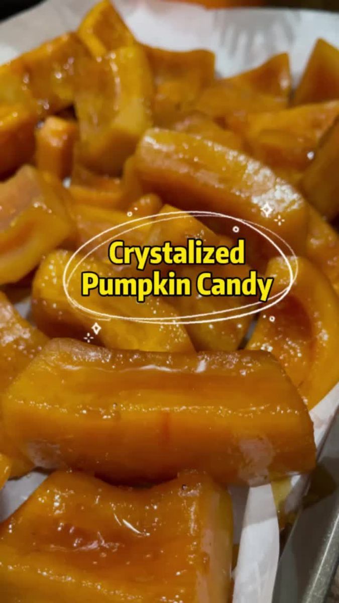 crystalized pumpkin candy on a plate with a fork and spoon next to it that says crystalized pumpkin candy