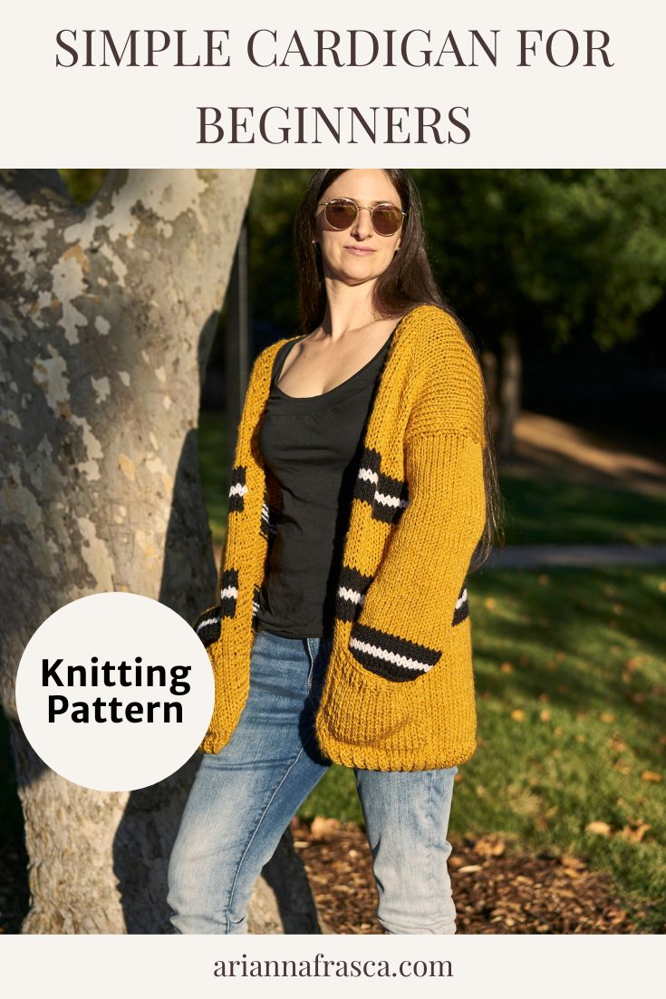 a woman standing next to a tree wearing a knitted cardigan for beginners