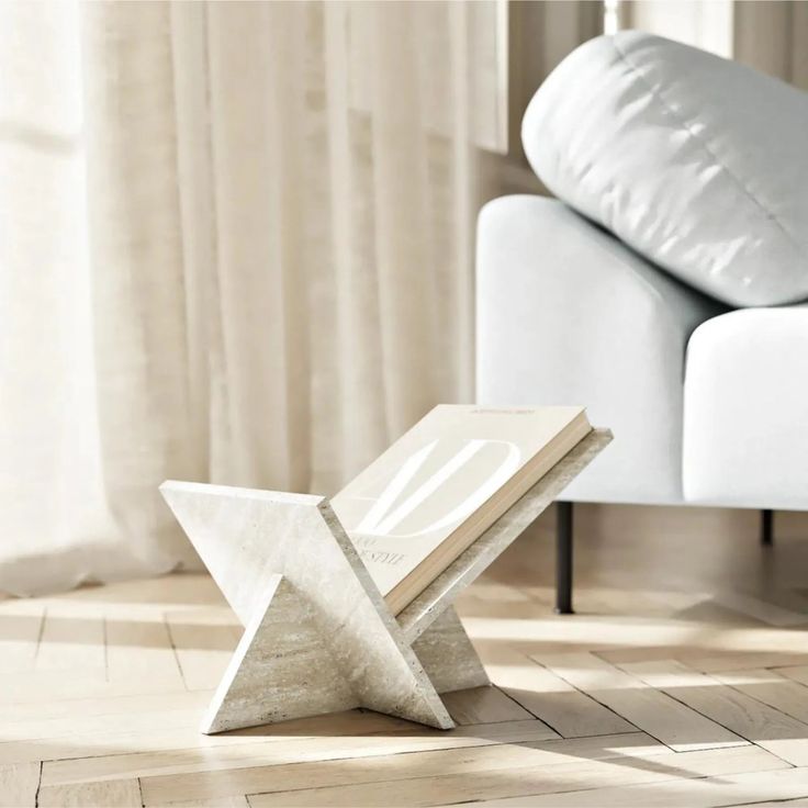 a white chair sitting on top of a hard wood floor