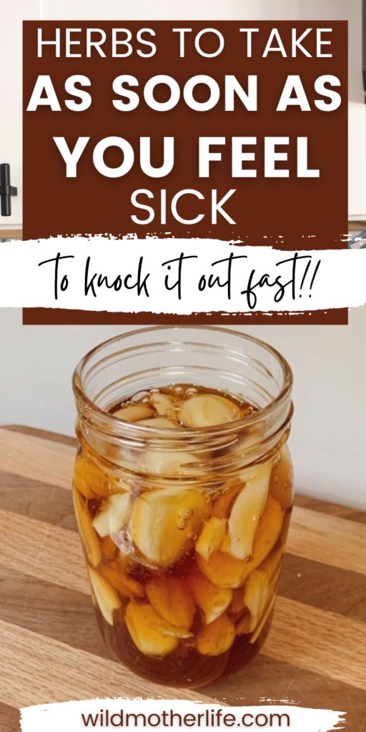 a jar filled with pickles sitting on top of a wooden table