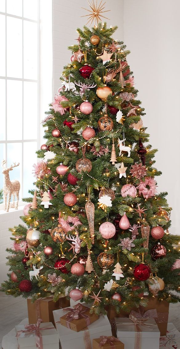 a decorated christmas tree with presents under it