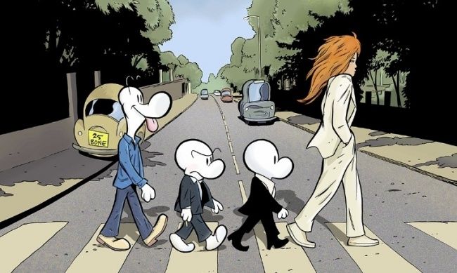 an image of people crossing the street in front of them with cartoon characters on it