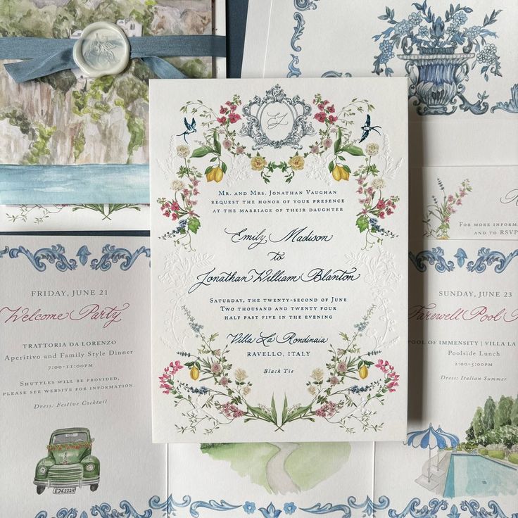 the wedding stationery is laid out on top of each other, with an antique car