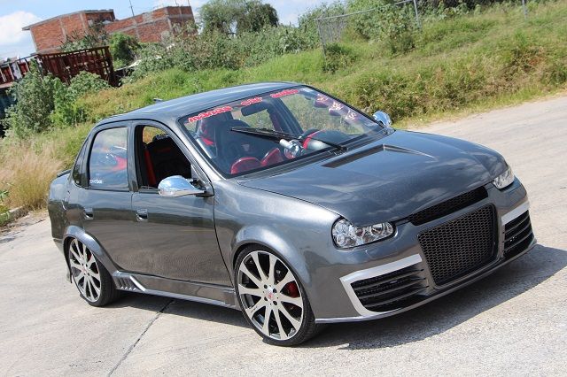 a gray car parked on the side of a road