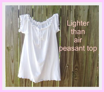 a white shirt hanging on a fence with the words lighter than air pleasant top