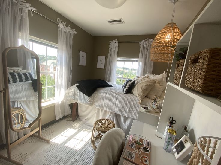 a bedroom with a bed, mirror and other items on the table in front of it