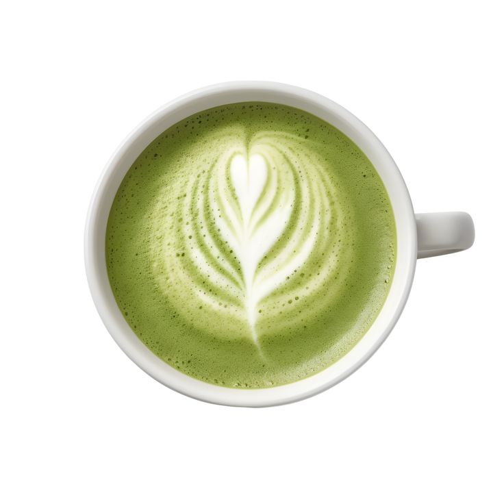 a cup of matcha latte with a leaf drawn in the foam on top