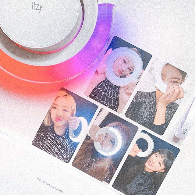 four polaroid photos are placed next to an orange and white object with the letter c on it