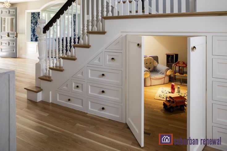 an open door leading to a living room with stairs