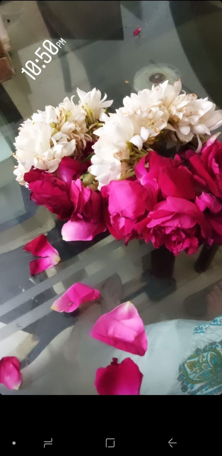 some pink and white flowers on a table