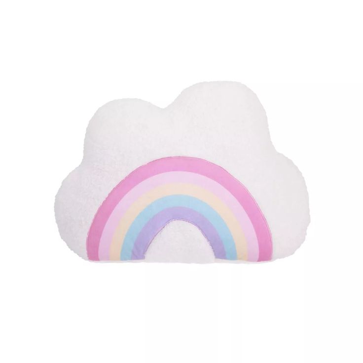 a cloud shaped pillow with a rainbow on it's side and a white background